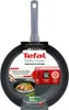 A Tefal frying pan is shown in its packaging, with promotional text and graphics. Voir les images du produit