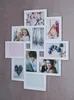 A collage of photos in a white multi-photo frame mounted on a textured wall. Produktbild-Vorschau