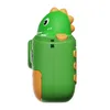 Side view of a green dinosaur-shaped children's camera. Voir les images du produit