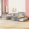 A bedroom scene with multiple beds and bedding. Anteprima dell’immagine prodotto