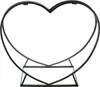 A black metal heart-shaped firewood rack on a white background. Produktbild-Vorschau