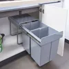 A pull-out trash bin system installed under a kitchen counter. Podgląd zdjęcia produktu