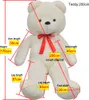 A large white teddy bear with measurement lines and labels indicating its dimensions. Náhled obrázku produktu