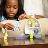 A child is playing with a toy playset. Anteprima dell’immagine prodotto