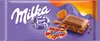 A Milka & Daim chocolate bar wrapper with a piece of chocolate and caramel chunks shown. Produktbild-Vorschau