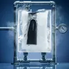 A black thermos bottle is encased in ice, connected to pipes with steam coming off. Náhled obrázku produktu