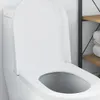A close-up view of a white toilet seat with the lid open. Podgląd zdjęcia produktu