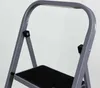 A close-up view of the top section of a gray metal step stool. Náhled obrázku produktu