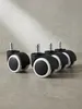 Leicht seitliche Perspektive der Hartbodenrollen, die die robuste Kunststoffkonstruktion und das Doppelrad-Design zeigt._#sku_SAFSPM1.913# Produktbild-Vorschau
