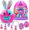 A collection of Rainbocorns Eggzania Surprise Mania toys, including a large plush bunny and several smaller surprise eggs and accessories. Náhled obrázku produktu
