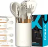 A set of white silicone kitchen utensils with wooden handles displayed in a white holder, next to its packaging. Náhled obrázku produktu
