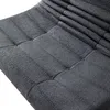 A close-up view of a gray tufted sofa or chair. Produktbild-Vorschau