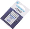 A package of sewing needles on a blue denim fabric background. Náhled obrázku produktu