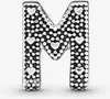 A close-up studio shot of a silver letter M charm. Anteprima dell’immagine prodotto