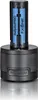 A black charging base with a blue and black battery pack inserted. Náhled obrázku produktu