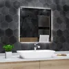 A modern bathroom vanity with a sink and a lit mirror. Produktbild-Vorschau