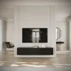 A modern living room with a wall-mounted TV and a dark cabinet below. Produktbild-Vorschau
