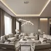 A modern living room with a large sectional sofa, coffee table, and decorative lighting. Anteprima dell’immagine prodotto