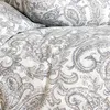 A close-up view of a bed linen set with a paisley pattern. Produktbild-Vorschau