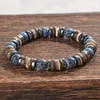 Elastische armband met parels van gepolijste steen, houten Productafbeelding-voorbeeld 3
