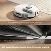 A robot vacuum cleaner is shown on a floor, with a close-up view of its brush mechanism. Produktbild-Vorschau