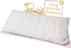 A white quilted pillow with a tag and informational graphics in the background. Produktbild-Vorschau