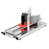 A stainless steel tomato slicer with a black handle and red food holder, shown on a white background. Anteprima dell’immagine prodotto