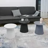 Three round side tables are arranged on a rug in front of a sofa. Náhľad obrázku produktu