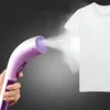 A hand holds a handheld garment steamer spraying steam onto a white t-shirt. Produktbild-Vorschau