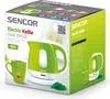 The image shows the retail packaging of a Sencor electric kettle. The packaging is mostly green and white, with product images and text. Náhled obrázku produktu