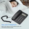 A person sleeping in bed next to a corded telephone. Náhľad obrázku produktu