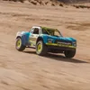 A remote-controlled truck driving on a sandy terrain. Produktbild-Vorschau