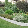 A garden bed with a metal edging separating the lawn from the plants. Produktbild-Vorschau