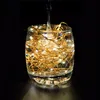 A glass of water with LED string lights inside, with water being poured into it. Produktbild-Vorschau