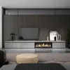 A modern living room with a TV stand, fireplace, and ottoman. Anteprima dell’immagine prodotto