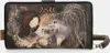 A close-up shot of an Anekke wallet with a dark brown background and a whimsical illustration. Produktbild-Vorschau
