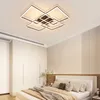 A bedroom with a bed, wardrobe, and a modern ceiling light. Podgląd zdjęcia produktu
