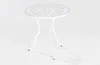 A white round table with a decorative top and three legs, set against a plain white background. Produktbild-Vorschau