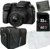 A collection of camera accessories including a camera, battery, memory card, and camera bag. Produktbild-Vorschau