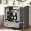 A grey bathroom vanity with its doors and drawer open, showcasing its interior storage. The vanity is placed in a bathroom setting with tiled walls and a wooden floor. Podgląd zdjęcia produktu