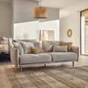 A modern living room with a light gray sofa, decorative pillows, a wooden pendant lamp, and artwork on the wall. Náhľad obrázku produktu