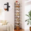 A tall, narrow bookshelf with multiple wooden shelves and a black metal frame, placed in a home interior next to a sofa and a plant. A close-up inset shows the mounting bracket. Produktbild-Vorschau