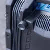 A close-up view of a black compressor with some cables and a blue interior visible. Produktbild-Vorschau