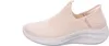 A side view of a beige Skechers slip-on shoe against a white background. Voir les images du produit