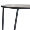 A close-up view of the edge of a table with two legs visible. Anteprima dell’immagine prodotto