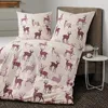 A neatly made bed with a duvet cover and pillowcases featuring a deer pattern. Produktbild-Vorschau