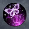 A round wall clock with a butterfly design. Produktbild-Vorschau