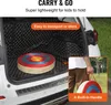 The image shows a target for archery in the trunk of a car and a person holding a target with a built-in handle. Produktbild-Vorschau