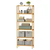 A tall, multi-shelf unit made of bamboo, filled with various items like storage boxes, folded textiles, and decorative objects. Produktbild-Vorschau