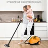 A woman is holding a baby while using a steam cleaner in a kitchen. Náhľad obrázku produktu